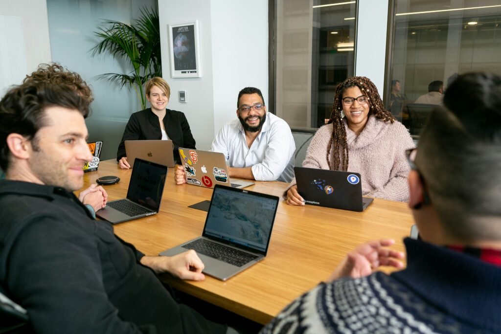 Diverse group of marketing professionals collaborating around a table in a modern office